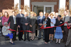 LRCS leadership and community dignitaries gather to ‘cut the ribbon’ for the official opening of the LRCS Laconia office.